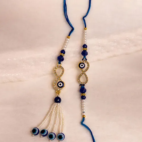 210553933_Trending-Nazar-Shield-Rakhi-Combo-For-Bhaiya-Bhabhi.webp
