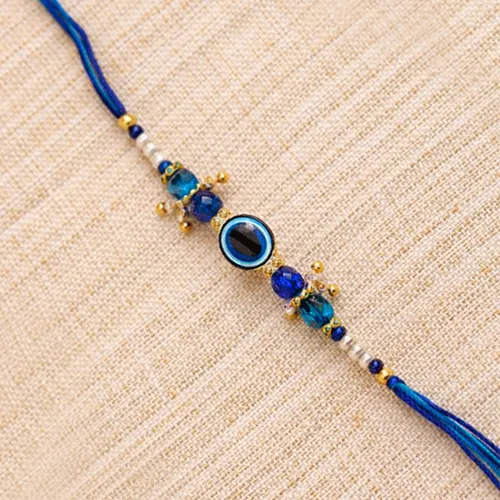 212688581_Nazar-Suraksha-Designer-Rakhi-with-Blue-Crystal-Beads.webp