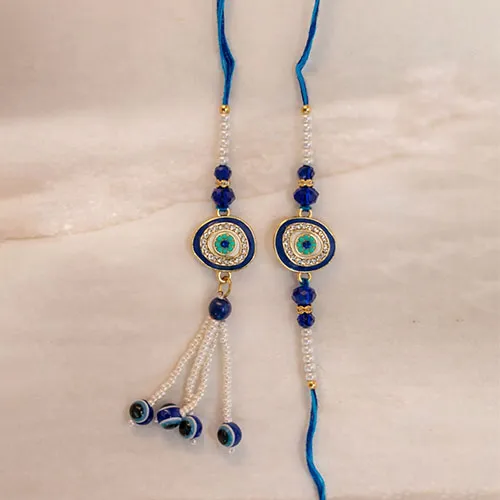 916516141_Evil-Eye-Couple-Rakhi-for-Bhaiya-Bhabhi.webp