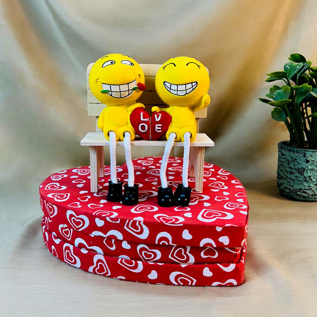 Smiley Couple Sitting on Love Bench